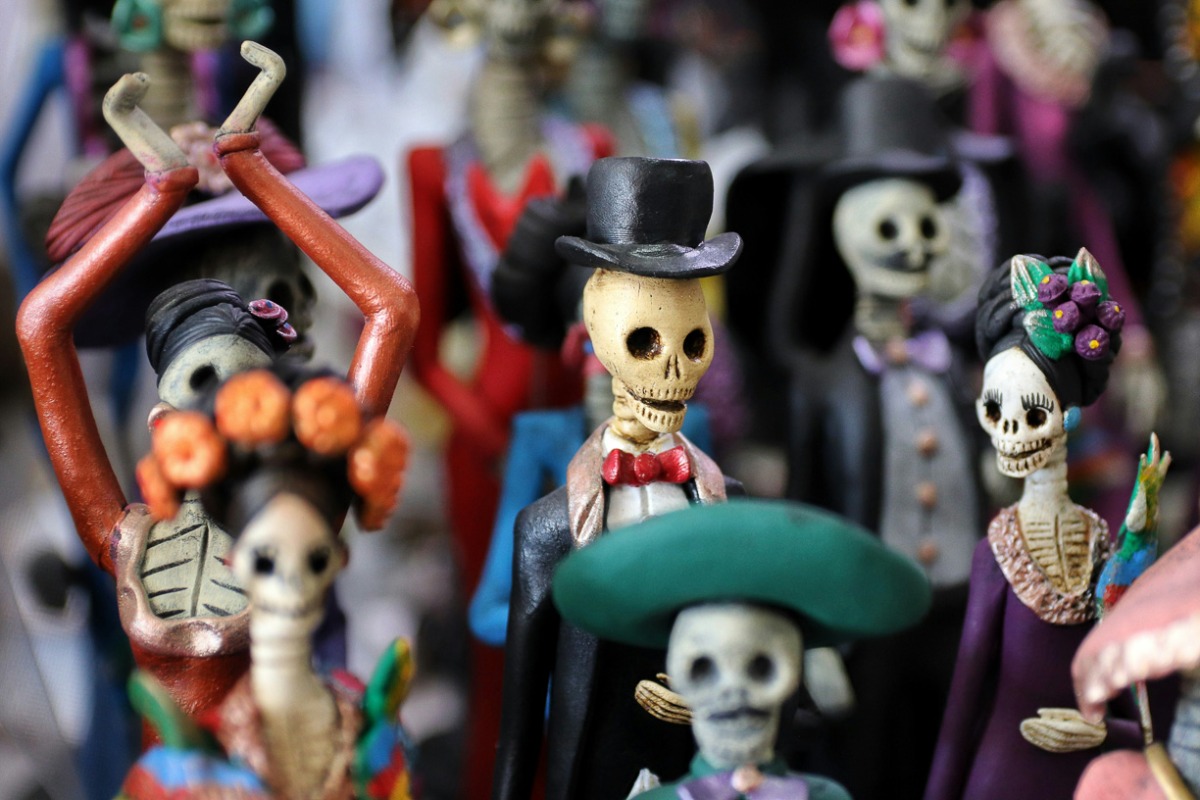 Hand-painted Oaxacan catrina figures on view at Café de Olla art space, San Francisco